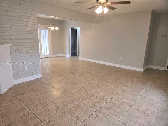 7917 Juniper St, Miramar, FL 33023 - spare room with a ceiling fan, light tile patterned floors, a chandelier, baseboards, and a textured ceiling