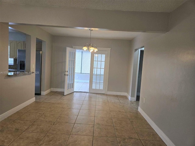 7917 Juniper St, Miramar, FL 33023 - unfurnished dining area with a chandelier, light tile patterned floors, baseboards, and french doors