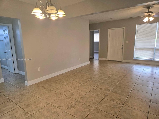 7917 Juniper St, Miramar, FL 33023 - empty room featuring a chandelier, light tile patterned flooring, ceiling fan, and baseboards
