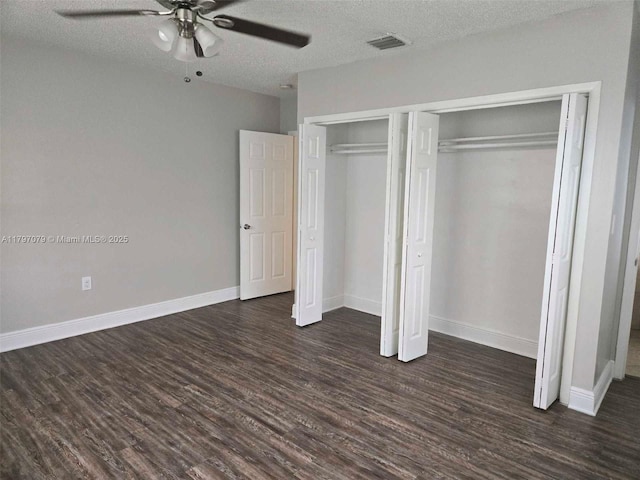 7917 Juniper St, Miramar, FL 33023 - unfurnished bedroom featuring dark wood-style flooring, a textured ceiling, ceiling fan, baseboards, and a closet