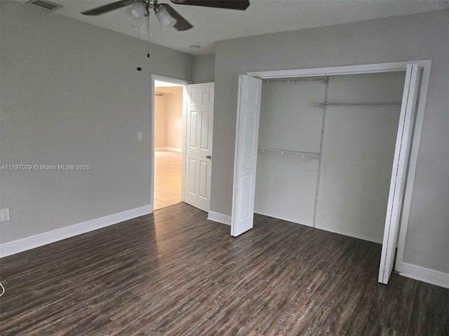 7917 Juniper St, Miramar, FL 33023 - unfurnished bedroom with wood finished floors, a closet, baseboards, and a ceiling fan