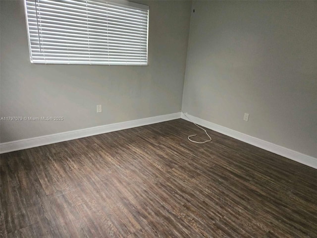 7917 Juniper St, Miramar, FL 33023 - unfurnished room featuring baseboards, dark wood-type flooring, and healthy amount of natural light