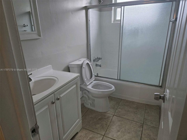 7917 Juniper St, Miramar, FL 33023 - bathroom featuring shower / bath combination with glass door, toilet, vanity, and tile patterned floors