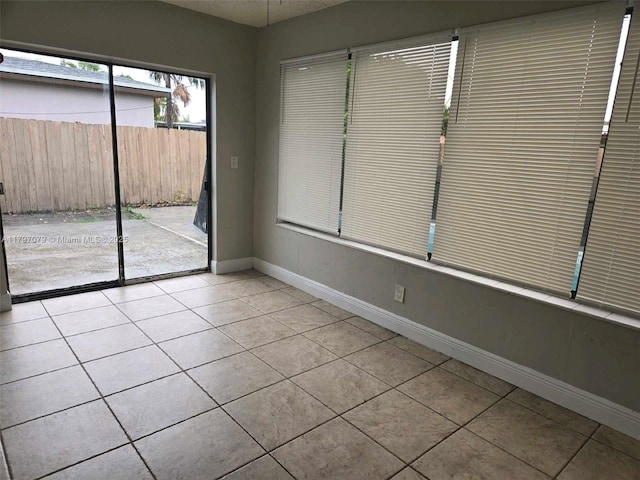 7917 Juniper St, Miramar, FL 33023 - empty room featuring light tile patterned floors and baseboards