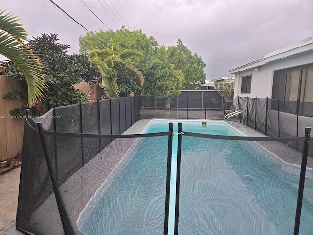 7917 Juniper St, Miramar, FL 33023 - view of pool featuring a fenced backyard