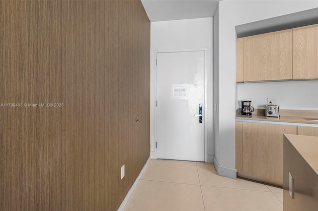 4111 S Ocean Dr Unit 2409, Hollywood, FL 33019 - kitchen with light tile patterned floors, light brown cabinets, modern cabinets, and light countertops
