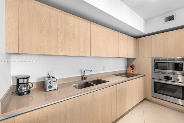 4111 S Ocean Dr Unit 2409, Hollywood, FL 33019 - kitchen with light brown cabinetry, appliances with stainless steel finishes, and a sink
