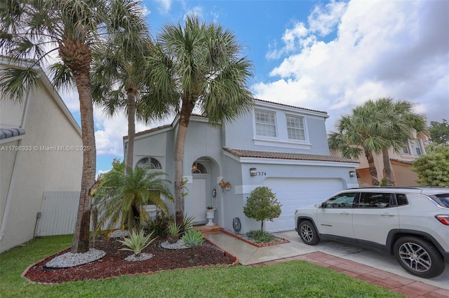 1374 NW 159th Ave, Pembroke Pines, FL 33028 - mediterranean / spanish-style home with stucco siding, a garage, a tiled roof, and concrete driveway