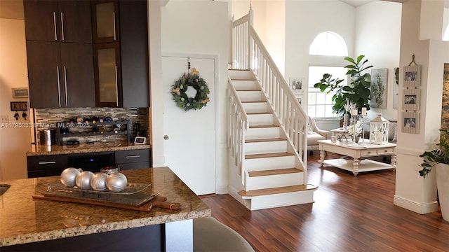 1374 NW 159th Ave, Pembroke Pines, FL 33028 - staircase featuring a high ceiling, wood finished floors, and baseboards