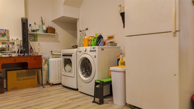 1374 NW 159th Ave, Pembroke Pines, FL 33028 - clothes washing area featuring independent washer and dryer, wood finished floors, and radiator heating unit