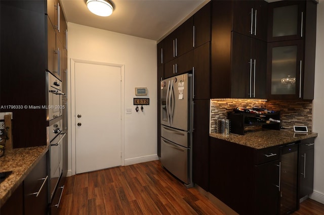 1374 NW 159th Ave, Pembroke Pines, FL 33028 - kitchen with appliances with stainless steel finishes, decorative backsplash, dark wood-style flooring, and dark stone countertops