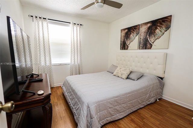 1374 NW 159th Ave, Pembroke Pines, FL 33028 - bedroom featuring wood finished floors, baseboards, a textured ceiling, and ceiling fan