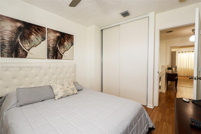 1374 NW 159th Ave, Pembroke Pines, FL 33028 - bedroom featuring wood finished floors, a closet, a textured ceiling, and ceiling fan