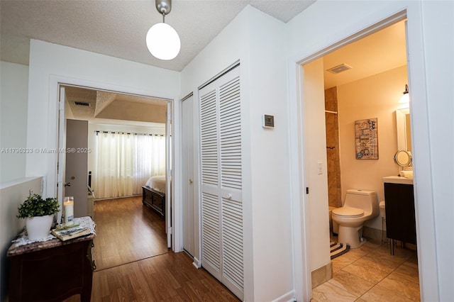 1374 NW 159th Ave, Pembroke Pines, FL 33028 - hallway with wood finished floors and a textured ceiling