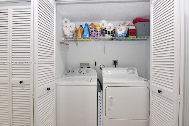 washroom with washer and dryer