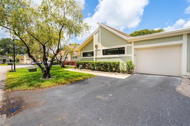 3620 E Forge Rd Unit 16, Davie, FL 33328 - mid-century inspired home featuring a garage, driveway, and a front lawn