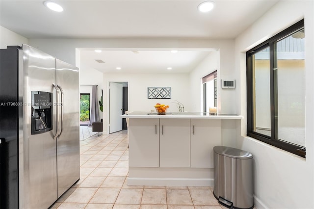 3620 E Forge Rd Unit 16, Davie, FL 33328 - kitchen with stainless steel fridge, a peninsula, healthy amount of natural light, recessed lighting, and light tile patterned floors