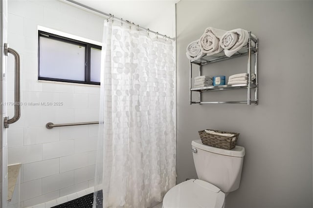 3620 E Forge Rd Unit 16, Davie, FL 33328 - bathroom featuring a tile shower and toilet