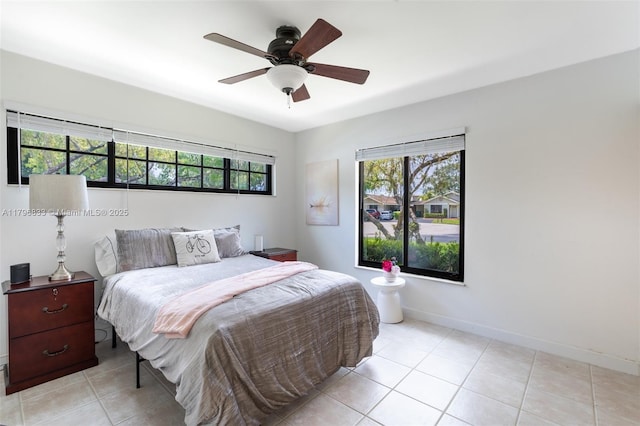3620 E Forge Rd Unit 16, Davie, FL 33328 - bedroom with multiple windows, light tile patterned flooring, and a ceiling fan