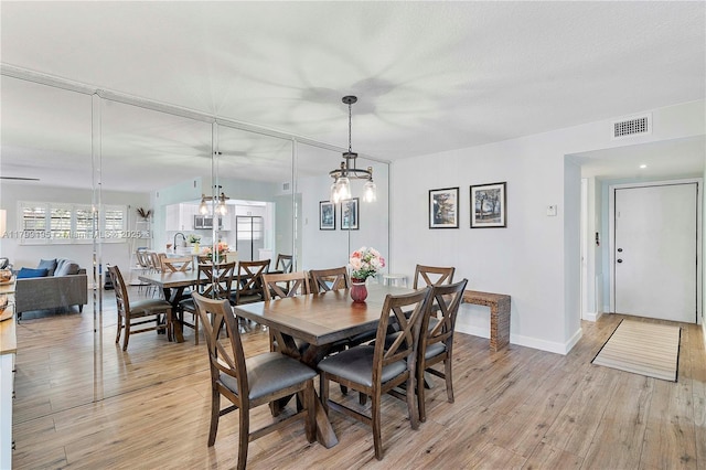 1779 NE 39th Ct Unit 1107, Pompano Beach, FL 33064 - dining area featuring light wood-style floors and baseboards