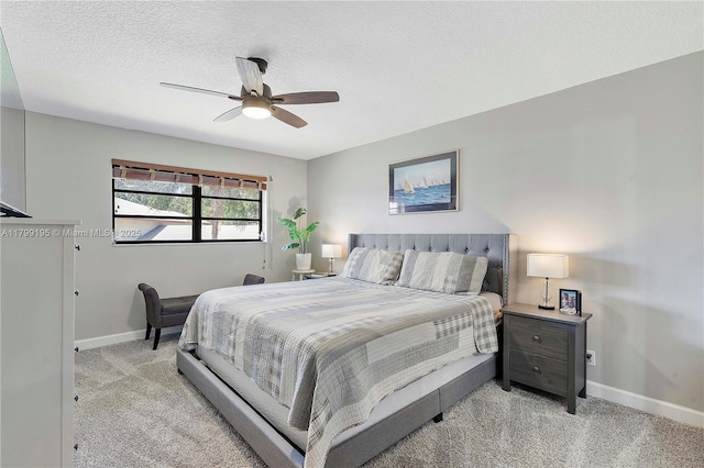 1779 NE 39th Ct Unit 1107, Pompano Beach, FL 33064 - bedroom featuring light carpet, baseboards, ceiling fan, and a textured ceiling