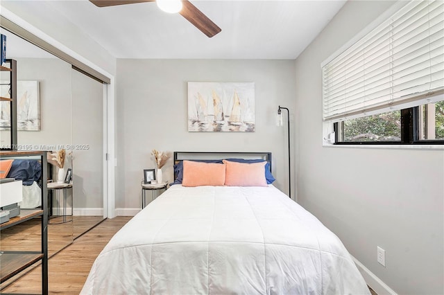 1779 NE 39th Ct Unit 1107, Pompano Beach, FL 33064 - bedroom with wood finished floors, a closet, a ceiling fan, and baseboards