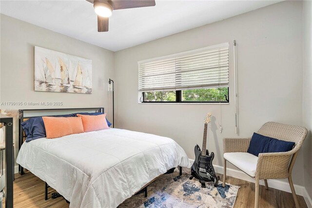 1779 NE 39th Ct Unit 1107, Pompano Beach, FL 33064 - bedroom featuring wood finished floors, baseboards, and a ceiling fan