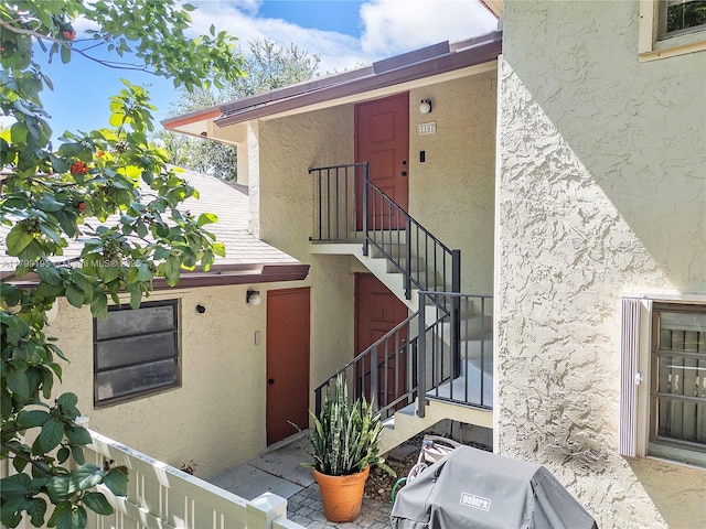 1779 NE 39th Ct Unit 1107, Pompano Beach, FL 33064 - doorway to property with stucco siding