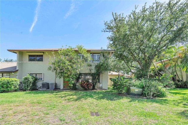 1779 NE 39th Ct Unit 1107, Pompano Beach, FL 33064 - back of house featuring stucco siding and a yard