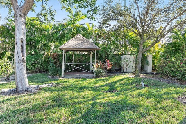 1779 NE 39th Ct Unit 1107, Pompano Beach, FL 33064 - view of grassy yard with a gazebo