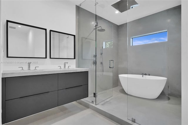 30 NE 50th St, Miami, FL 33137 - full bath with a stall shower, double vanity, and a soaking tub