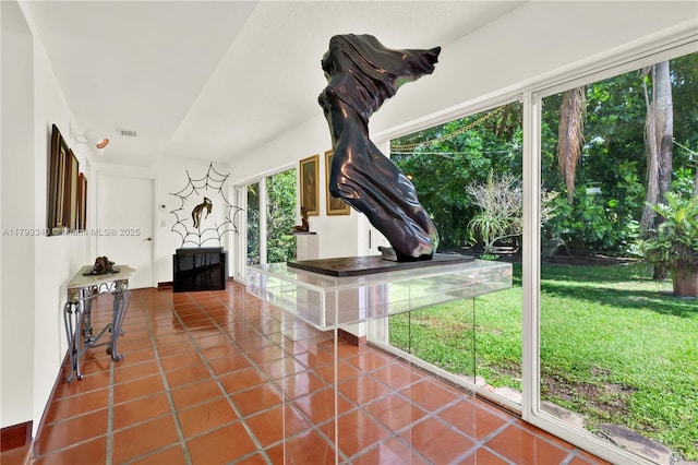 unfurnished living room with tile patterned flooring and a fireplace