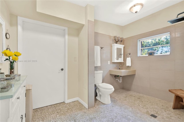 full bath with toilet and a sink