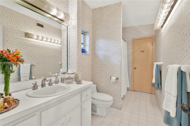 bathroom featuring wallpapered walls, tile patterned flooring, toilet, vanity, and curtained shower