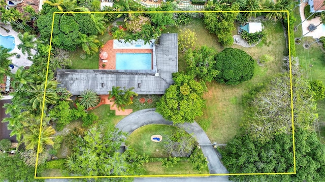 aerial overview of property's location featuring property boundaries highlighted and a pool