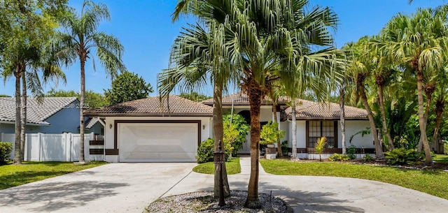 1041 NW 93rd Ter, Plantation, FL 33322 - view of front of property with stucco siding, driveway, a tile roof, and an attached garage