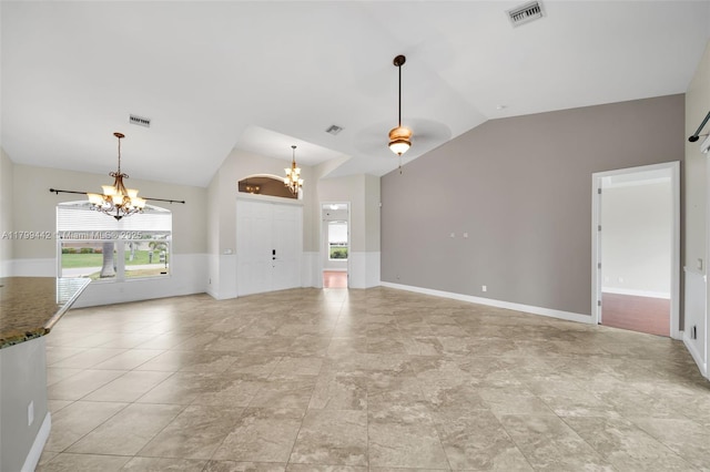3326 SW 8th St, Cape Coral, FL 33991 - unfurnished living room with a chandelier, vaulted ceiling, and baseboards