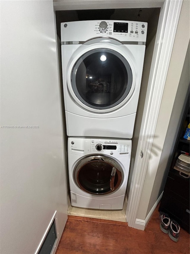 laundry area with stacked washer / drying machine
