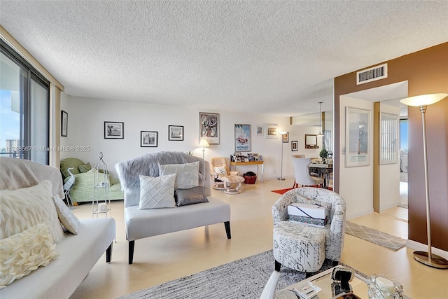 600 Three Islands Blvd Unit 1703, Hallandale Beach, FL 33009 - living room with a textured ceiling