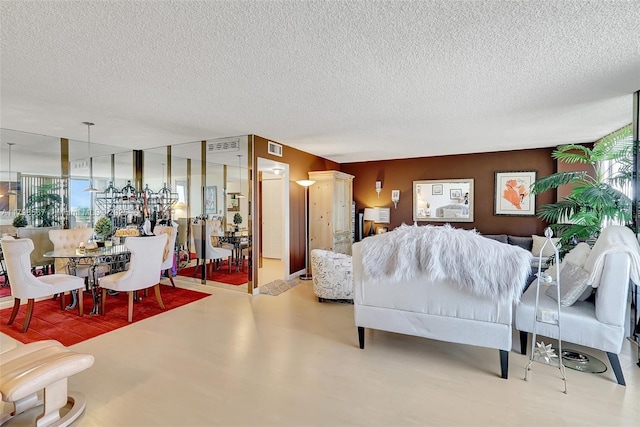 600 Three Islands Blvd Unit 1703, Hallandale Beach, FL 33009 - living area featuring a textured ceiling and healthy amount of natural light