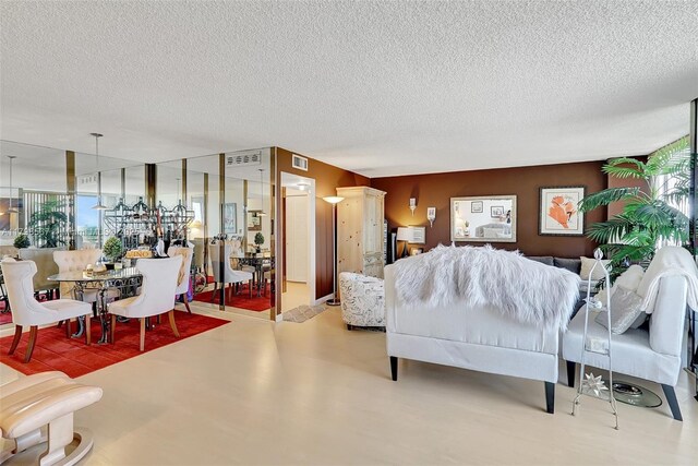 600 Three Islands Blvd Unit 1703, Hallandale Beach, FL 33009 - living area with a textured ceiling and healthy amount of natural light