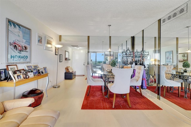 600 Three Islands Blvd Unit 1703, Hallandale Beach, FL 33009 - dining space with a textured ceiling