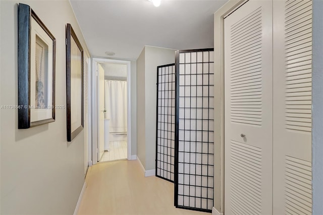 600 Three Islands Blvd Unit 1703, Hallandale Beach, FL 33009 - hallway with baseboards and light wood-style floors