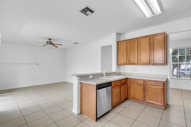 kitchen with dishwasher, a sink, light countertops, and a ceiling fan