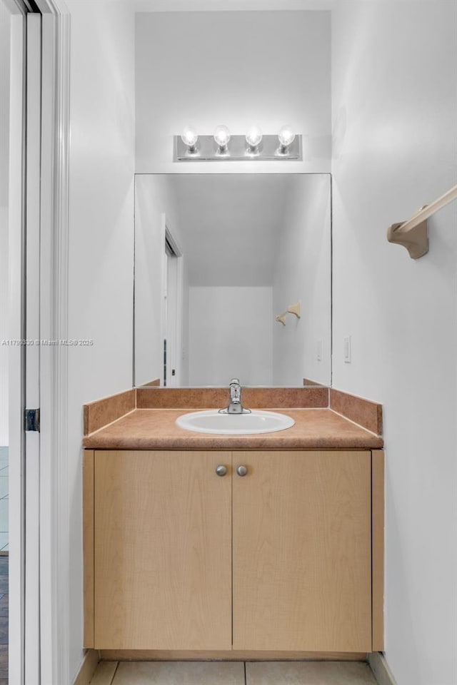 bathroom with vanity and tile patterned floors