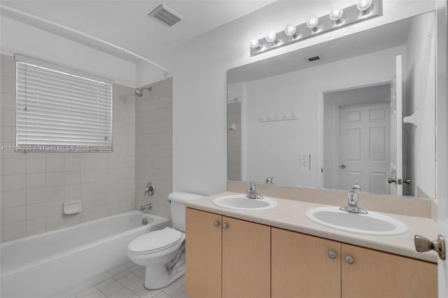 bathroom with tile patterned floors, toilet, shower / washtub combination, and double vanity