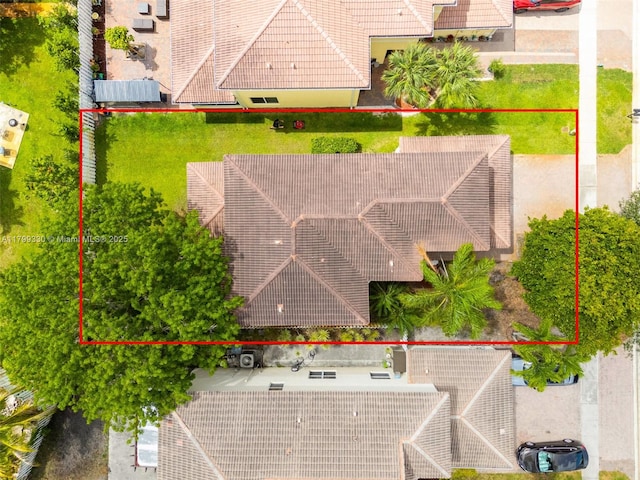 aerial view of property and surrounding area with property parcel outlined