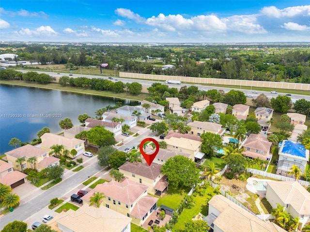 aerial perspective of suburban area featuring a large body of water