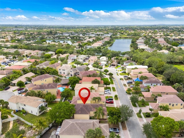 aerial view of residential area with a nearby body of water