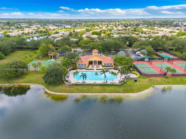 aerial view of a pool and a large body of water